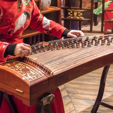 met_54498_lny_musicdance_375x375 playing a Traditional Chinese instrument