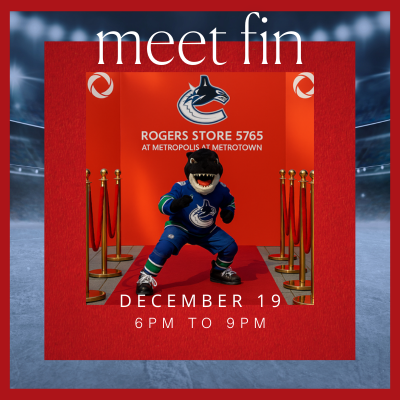 Fin the Vancouver Canucks mascot greeting families during a special appearance at the Rogers store.