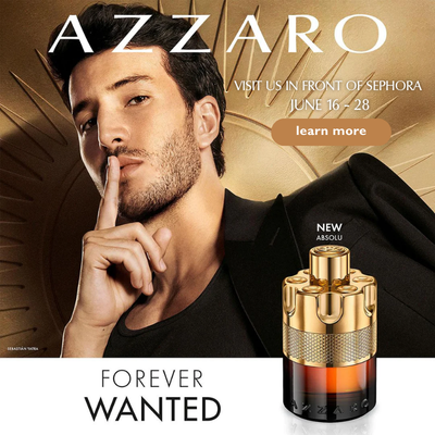 AZZARO fragrance activation display with perfume bottles and shoppers exploring scents